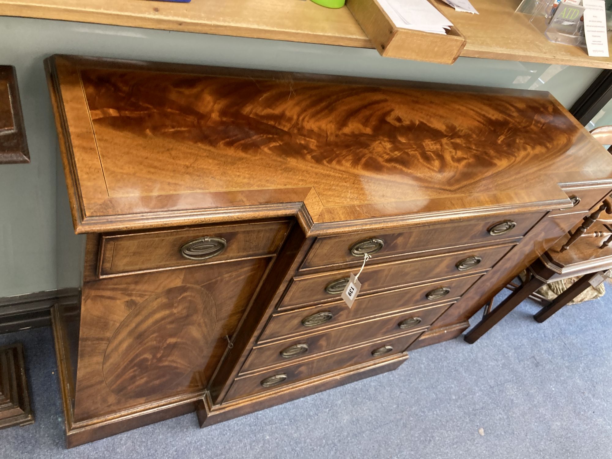 A George III style mahogany breakfront small sideboard, length 138cm, depth 42cm, height 89cm